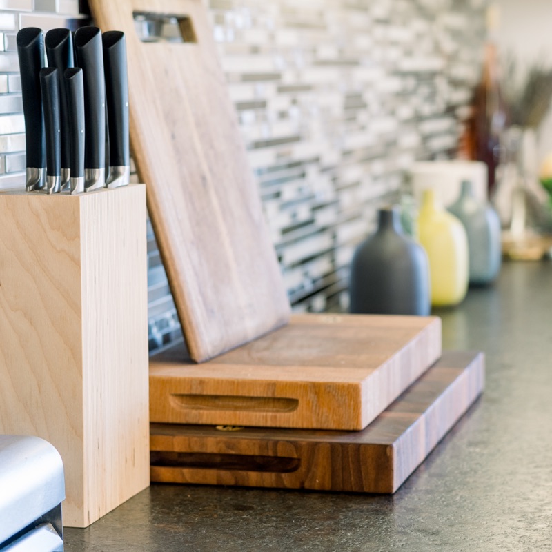 Stack of cutting boards on kitchen counter